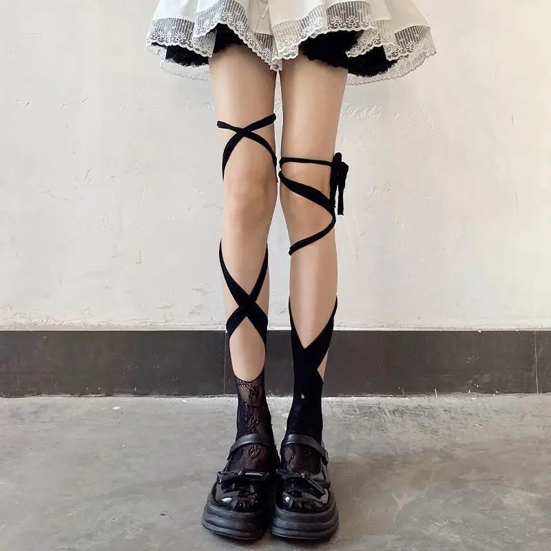 Alternative style Kawaii fishnet tights with straps, shown with pastel goth accessories