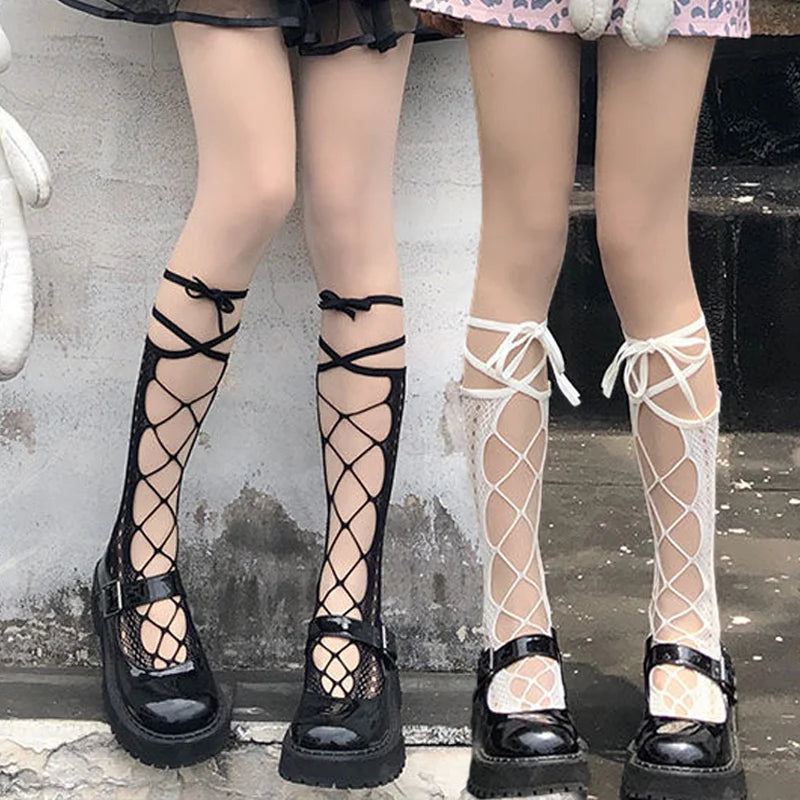 Detailed shot of split fishnet tights with kawaii strap design for alternative and Harajuku fashion