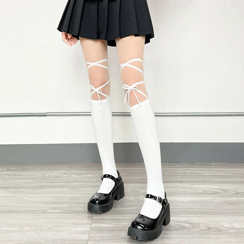 Unique split strap design on fishnet tights, great for pastel goth and cosplay outfits