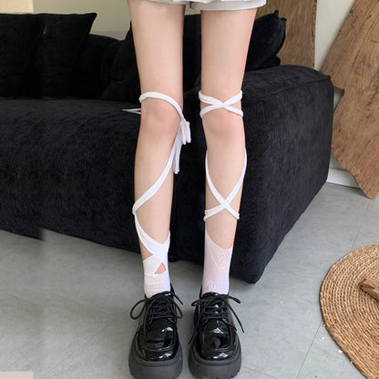 Harajuku-inspired Kawaii Split Fishnet Tights with unique strap accents for pastel goth looks